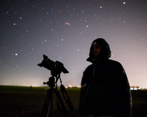 Qualitative research represented by telescope and night sky
