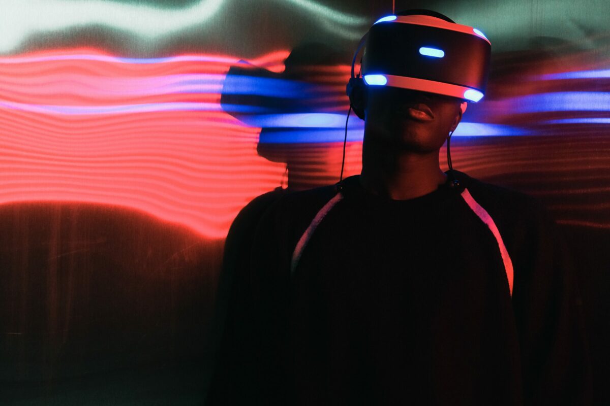 Man wearing virtual reality goggles with neon lights