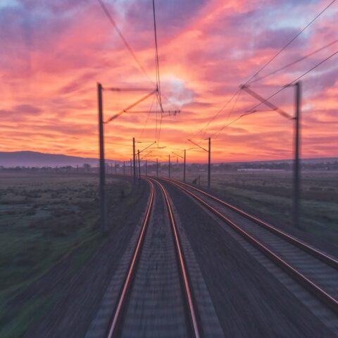 AI in Research Tips: Abstract photo of a train track at sunset