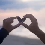 User Research Software depicted with two people holding up rocks that form a heart