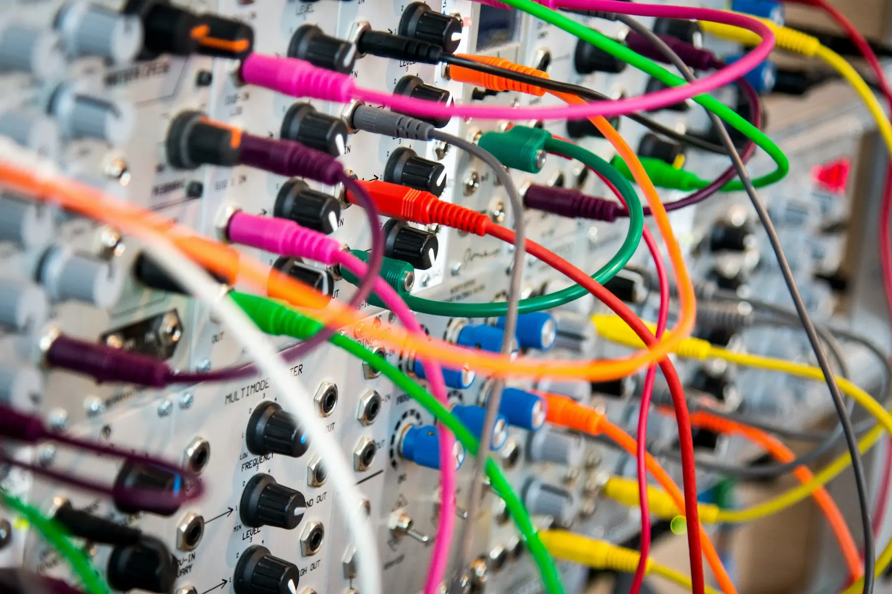 UX research process demonstrated by multicolored cables plugged into a cable box