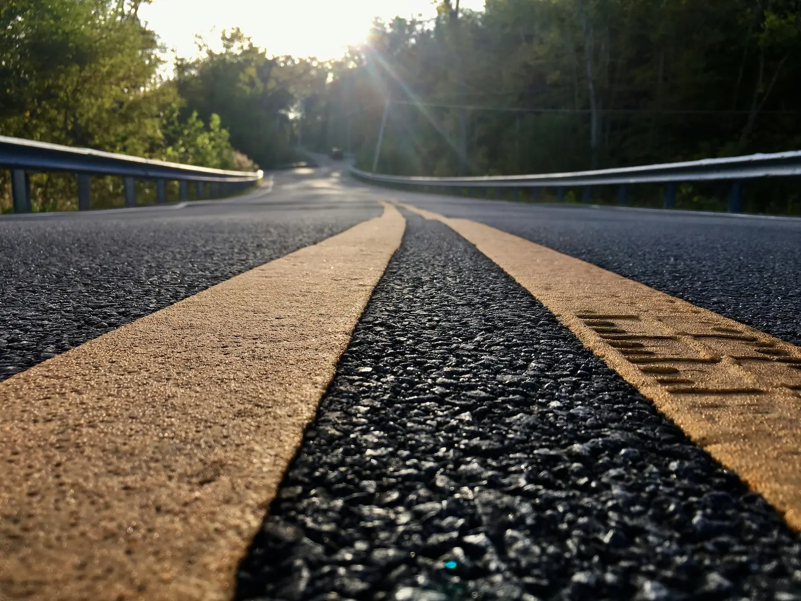 UX Analytics Strategy represented by a close-up of a road through the trees