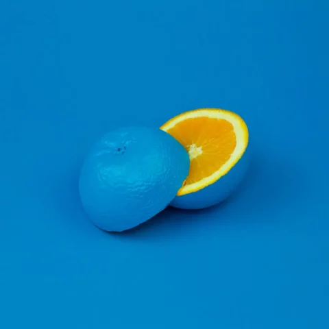 Changing Design blog post represented by a painted blue citrus on a blue background. Only the orange is what you'd expect.