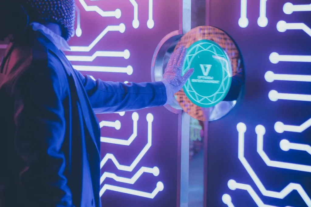 Person interacting with a futuristic touch interface with neon circuit patterns.