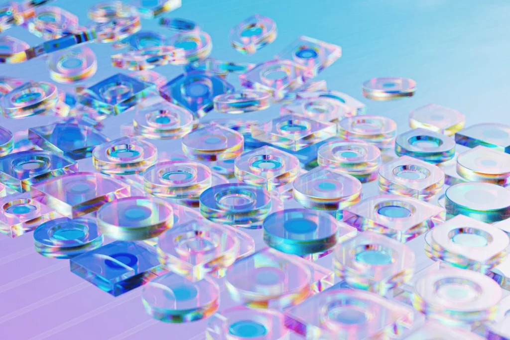 Abstract 3D image of transparent circular and square shapes reflecting rainbow-like colors on a gradient blue and purple background.