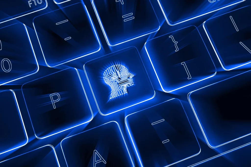 Futuristic keyboard with a glowing blue AI head icon, symbolizing artificial intelligence and technology.