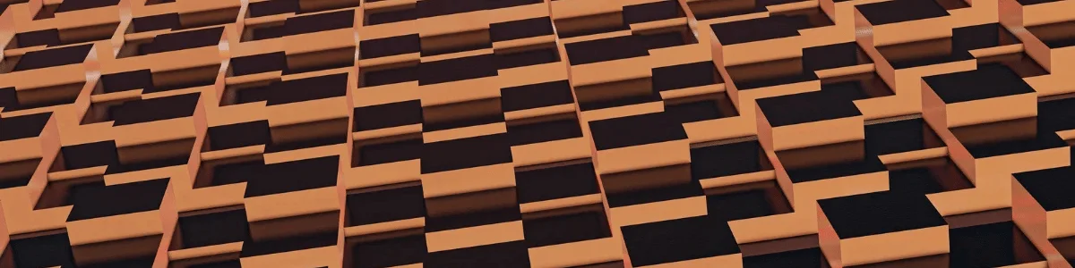 Abstract pattern of interlocking black and orange blocks creating a three-dimensional texture on a building facade.