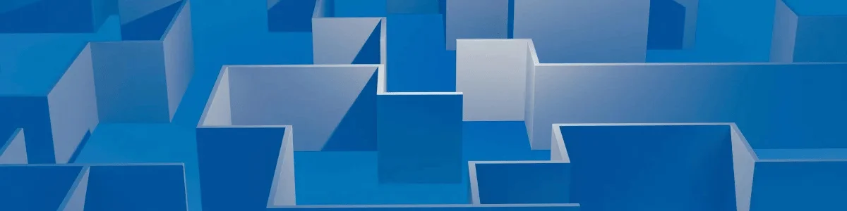 A top-down view of a complex blue maze with varying heights and shapes, creating a three-dimensional illusion.