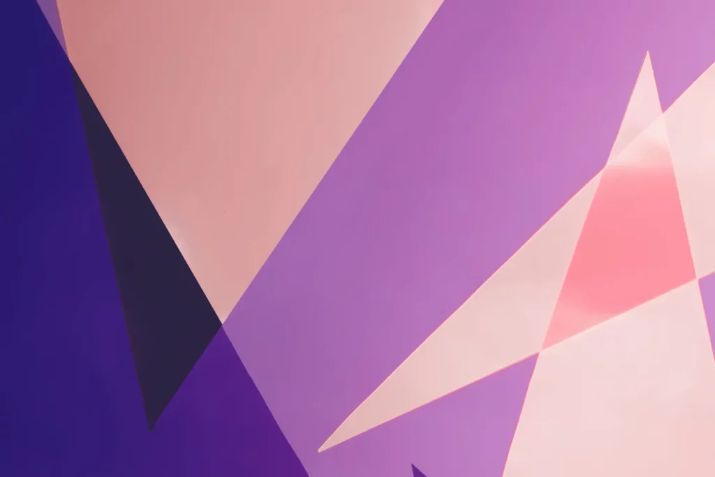 Modern digital artwork featuring overlapping triangular patterns.