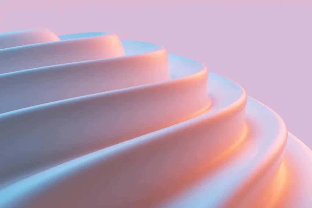 Close-up of a futuristic, layered design with soft blue and orange lighting against a pastel background.