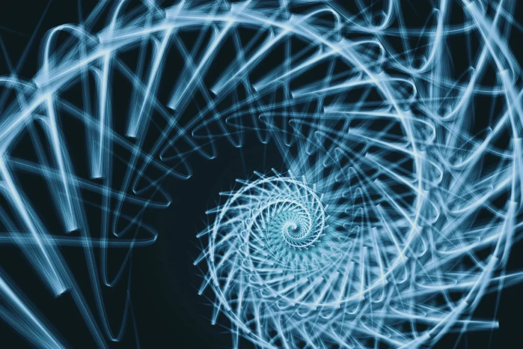 A swirling spiral of light blue lines against a dark background, creating a digital, abstract representation of movement and depth.