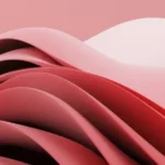 Abstract design featuring flowing layers in shades of pink and red against a soft pink background, creating a dynamic, textured appearance.