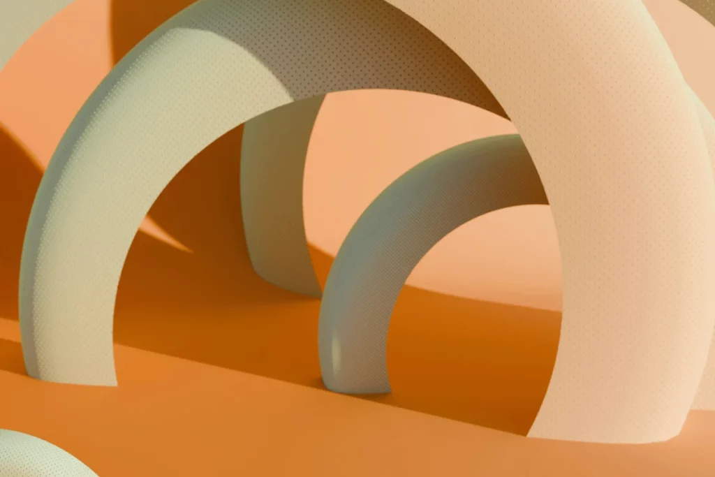 Close-up of overlapping semi-transparent arches on an orange background