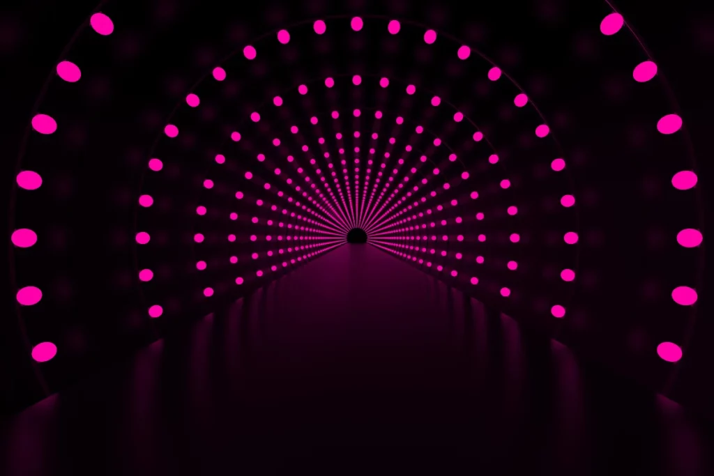 A mesmerizing digital tunnel made of concentric circles of pink lights leading to a dark center.