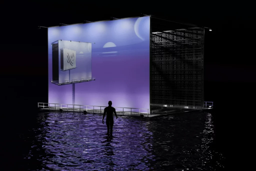 A futuristic digital screen on a platform in the water, with a person standing and silhouetted against the glowing backdrop.