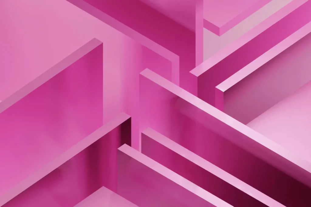 Abstract 3D geometric shapes in pink and purple forming a layered design.