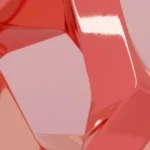 A glossy, intertwined sculpture with smooth, coral-colored surfaces against a soft pink background.