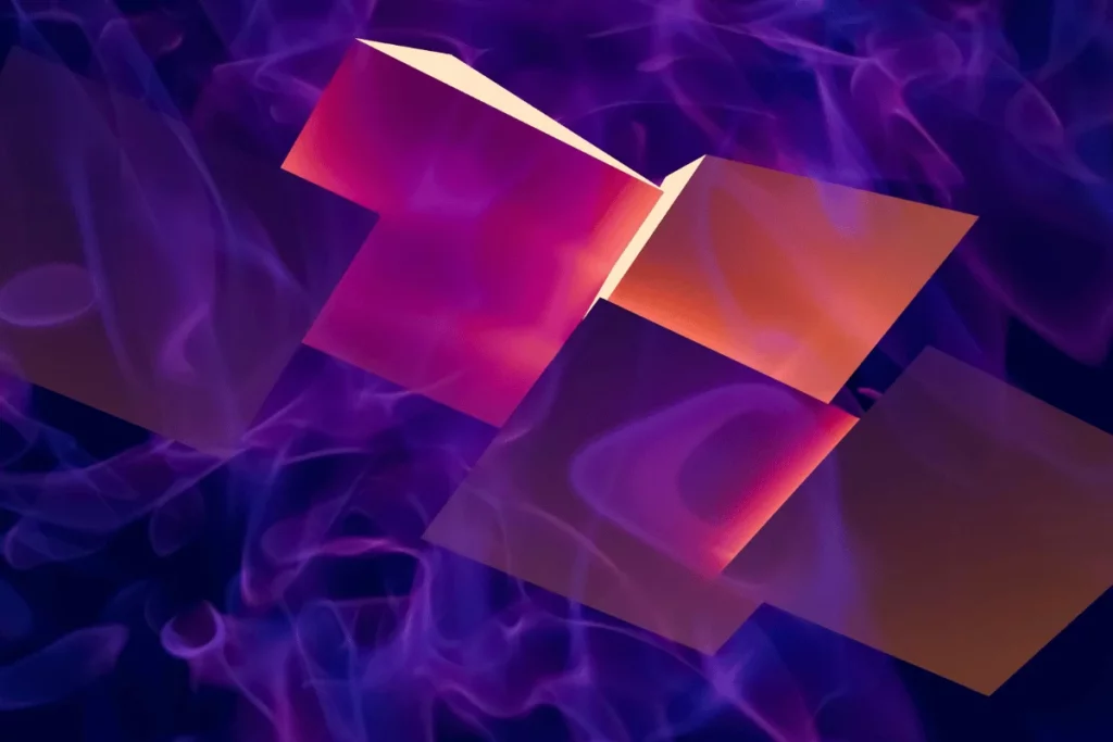 Geometric cubes in shades of pink and purple, hovering in the air above a swirling fog-like backdrop.