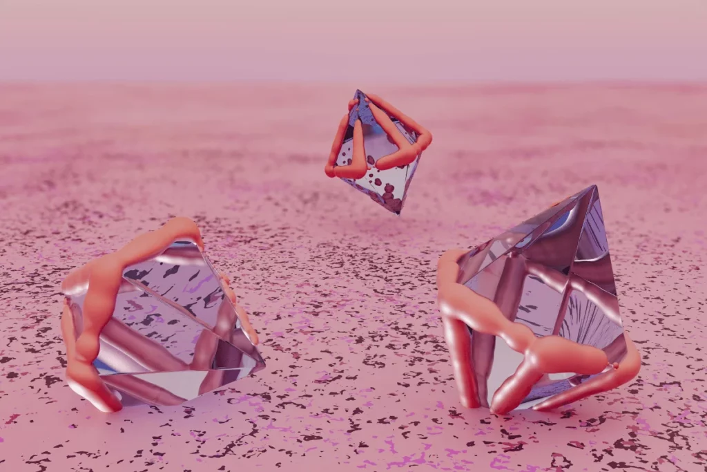 Abstract 3D glass pyramids with coral-like textures resting on a pink speckled surface.