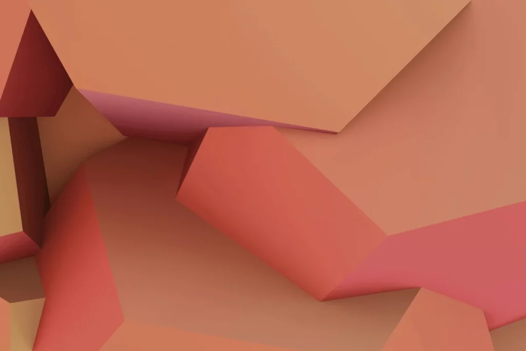 Abstract geometric shapes in shades of pink, orange, and yellow, creating a smooth, layered effect.