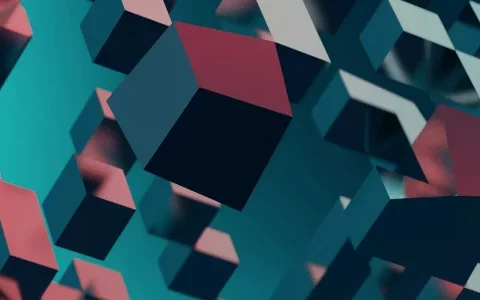 Abstract 3D composition of floating cubes in shades of blue, red, and gray, creating a dynamic and modern visual effect.