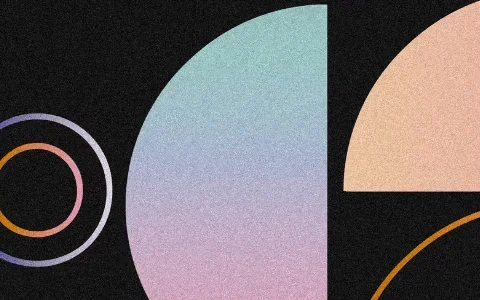 Geometric shapes in soft gradients of orange, pink, and blue against a black background, creating an abstract, modern design.