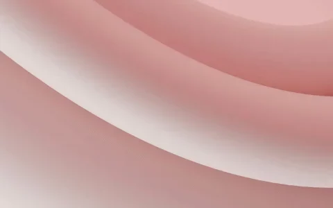 Soft, flowing curves in gradients of pink and white create a smooth and modern abstract background.