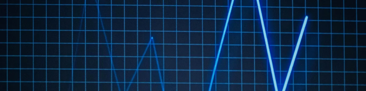 A blue line graph on a dark grid background, depicting fluctuating data with sharp peaks and valleys.