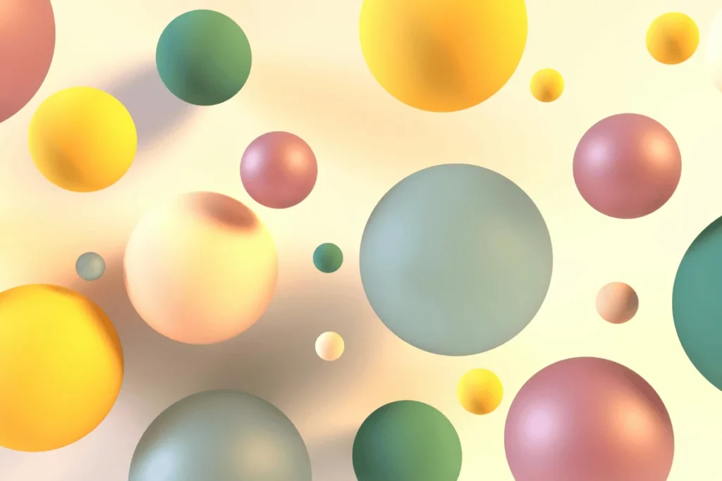Pastel 3D spheres floating on a soft beige background.