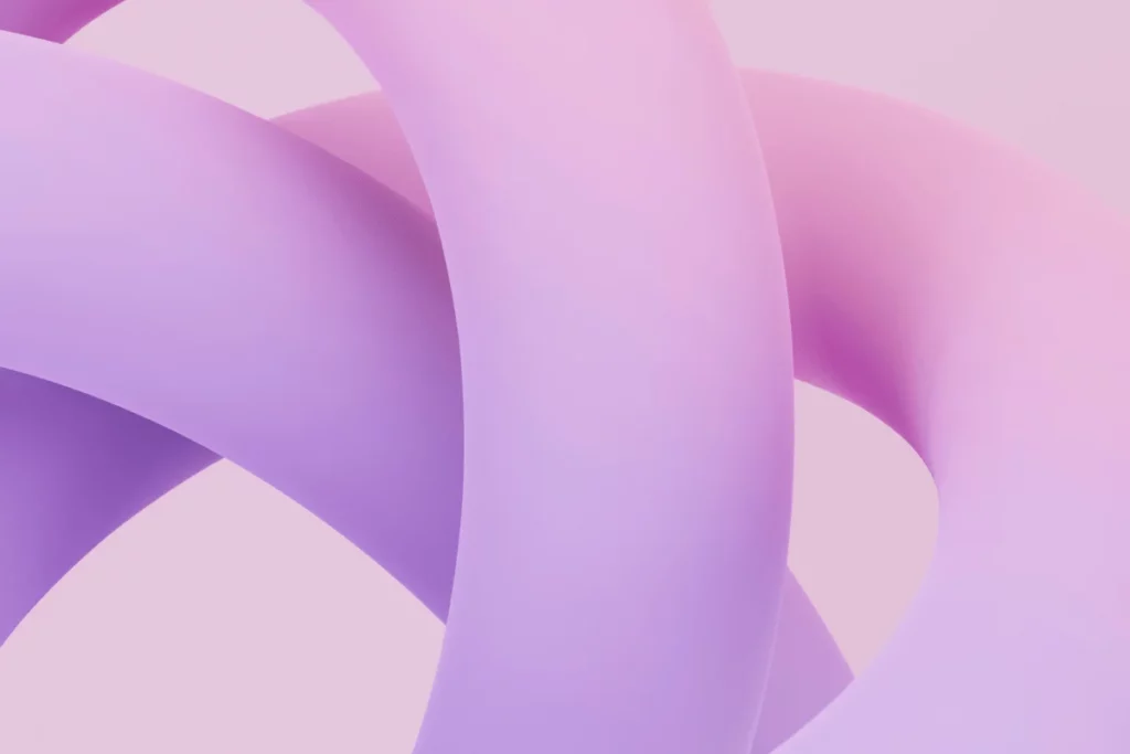 Soft pastel loops of pink and purple intertwined on light background.